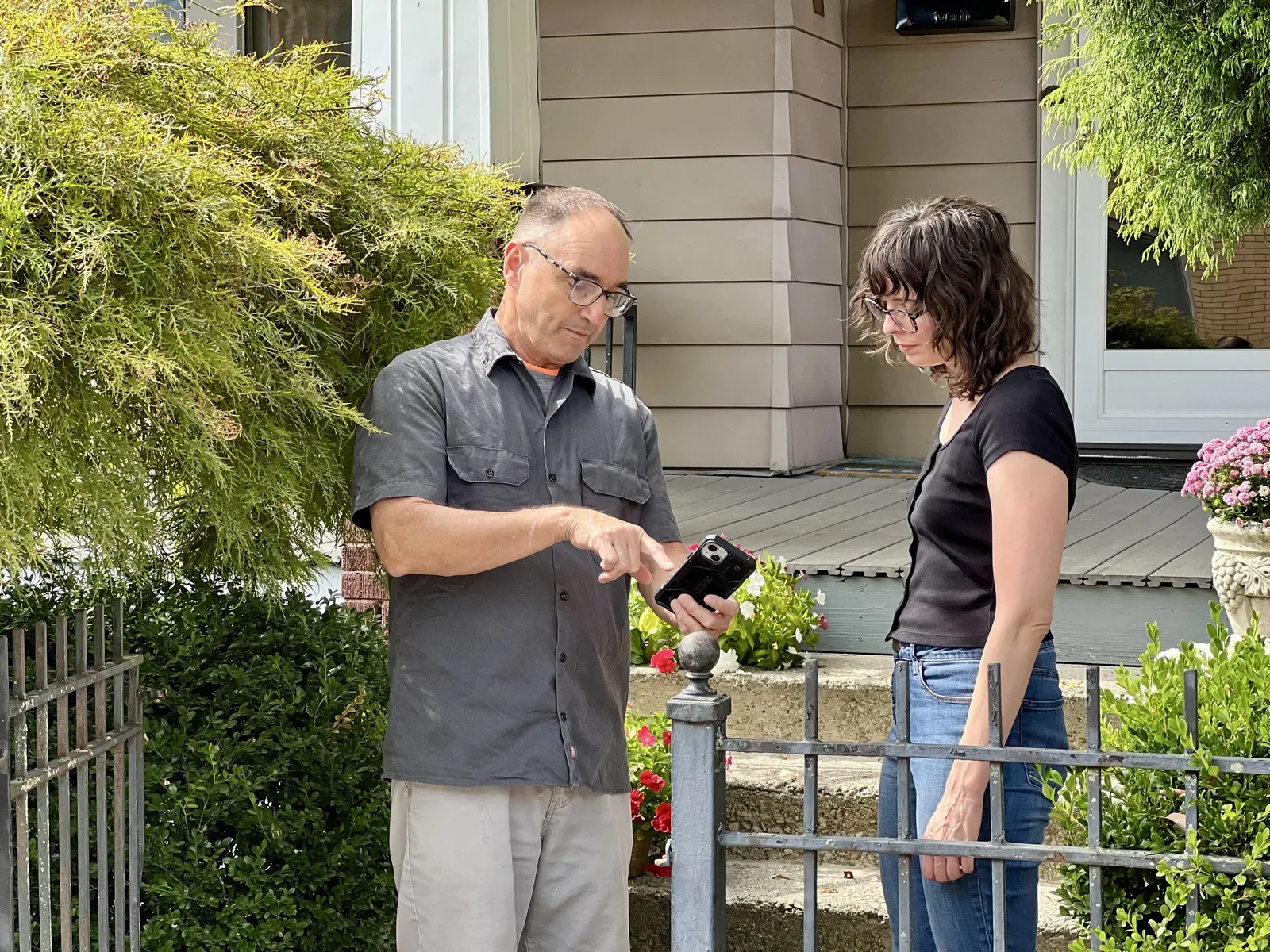 Ernest reviewing project details with customers